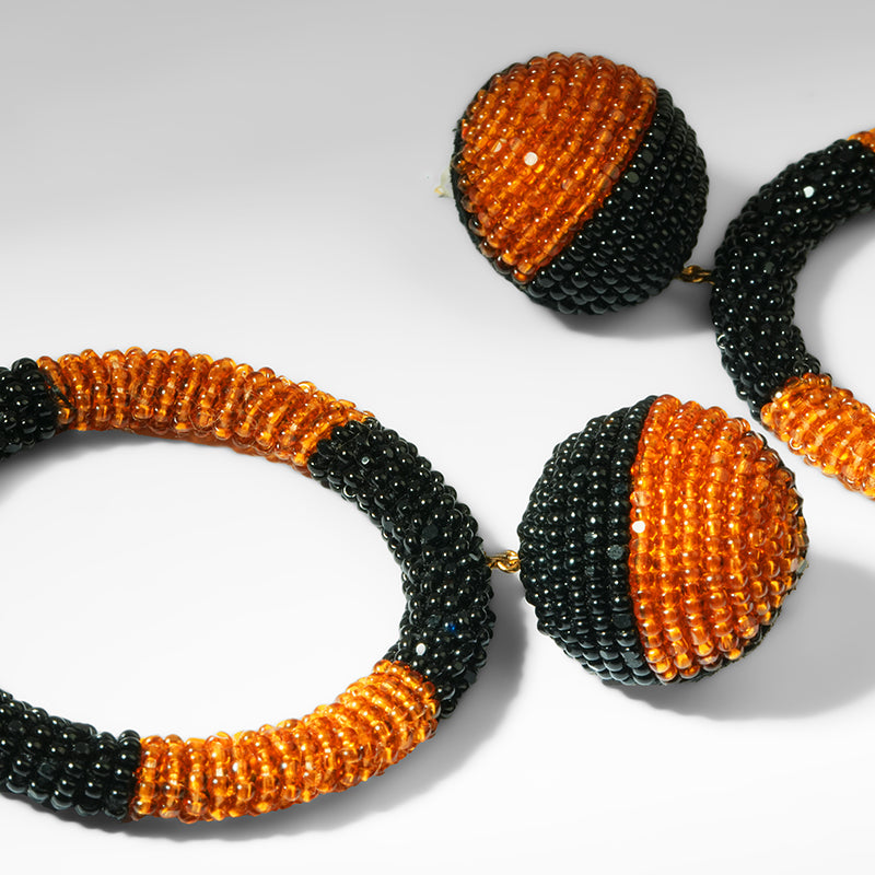 Close up of Deepa Gurnani Tavara Earrings in Mustard color