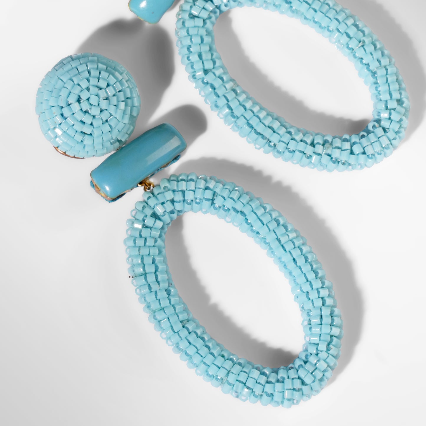 Close up of Deepa Gurnani Pret Yolanda Earrings in blue color