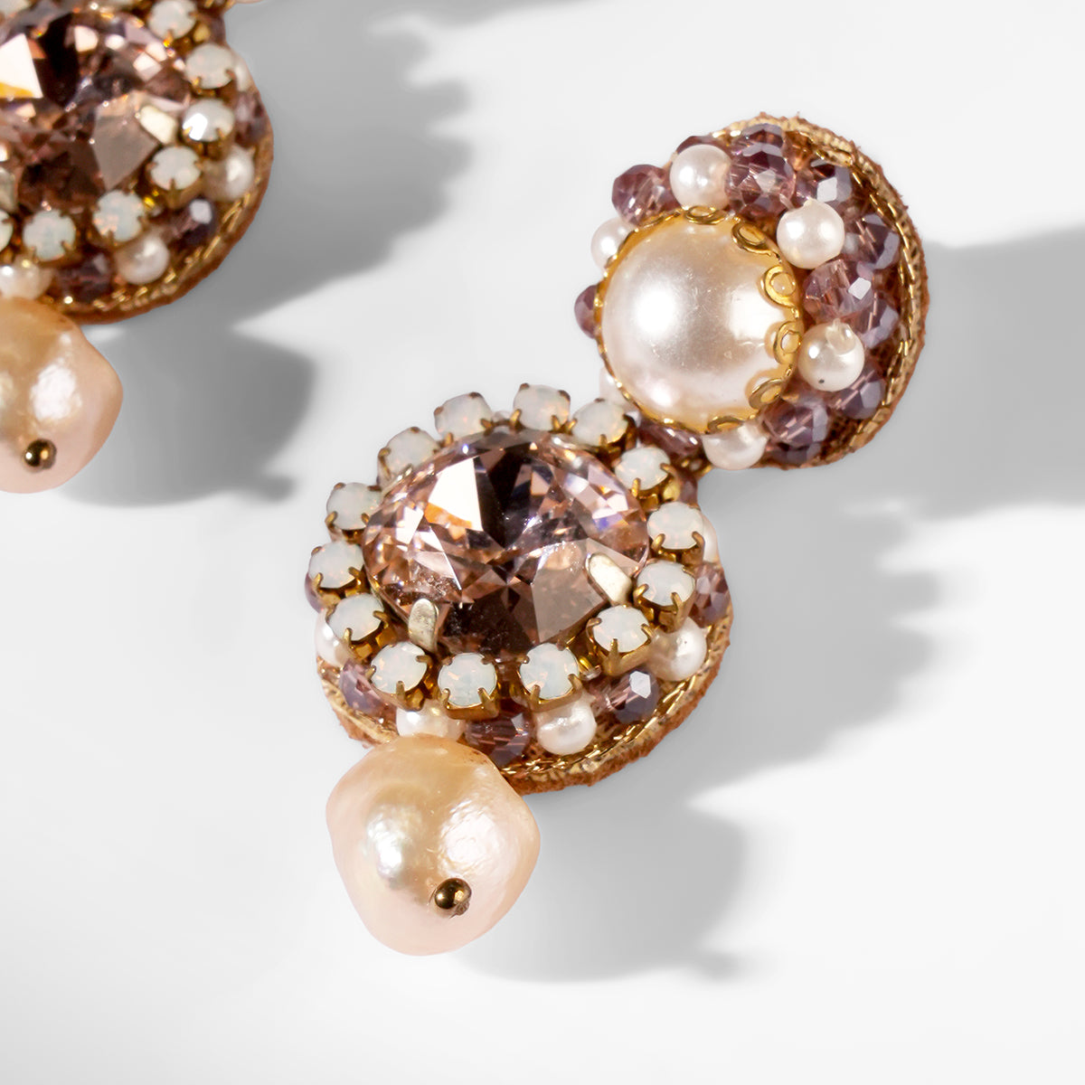 Close up of Deepa Gurnani Pret Mukta Earrings in pink color