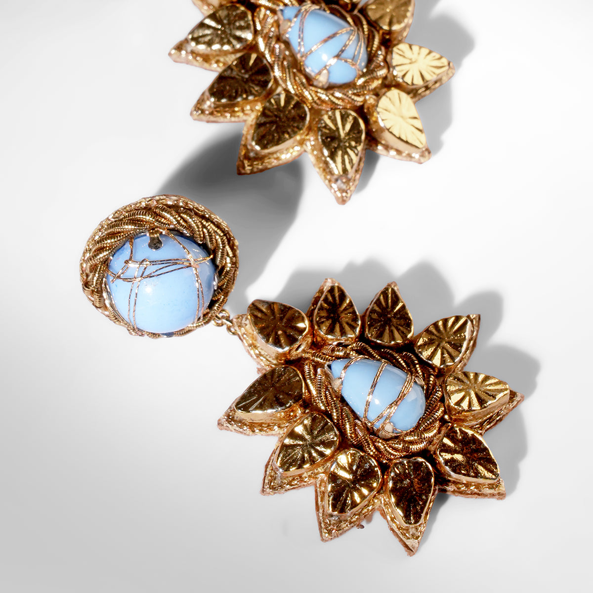 Close up of Deepa Gurnani Pret Ade Earrings in blue color
