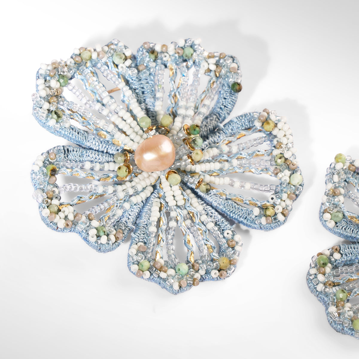 Close up of Deepa Gurnani Gregoriana Earrings in blue color