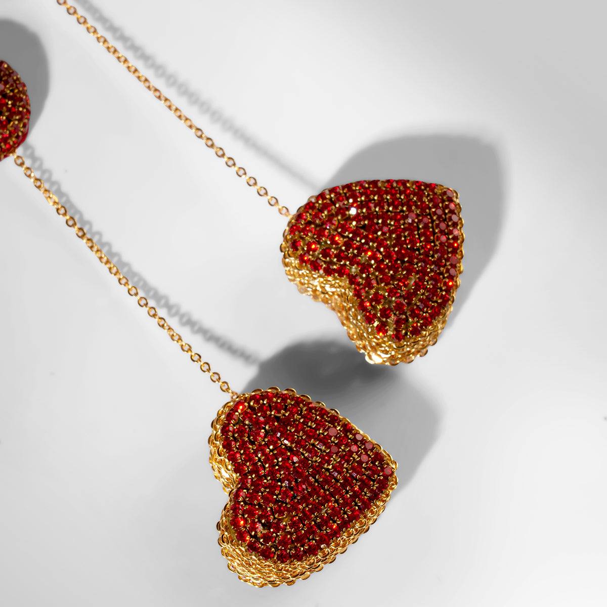 Close up of Deepa Gurnani Eros Earrings in red color