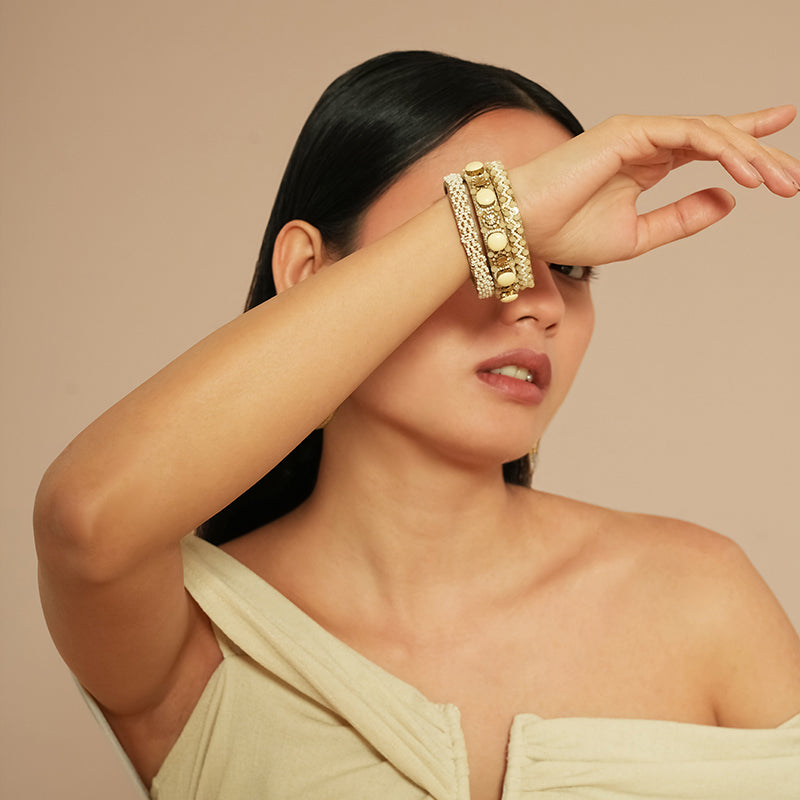 Model wearing Deepa Gurnani Pret Reed Bracelet in Ivory color
