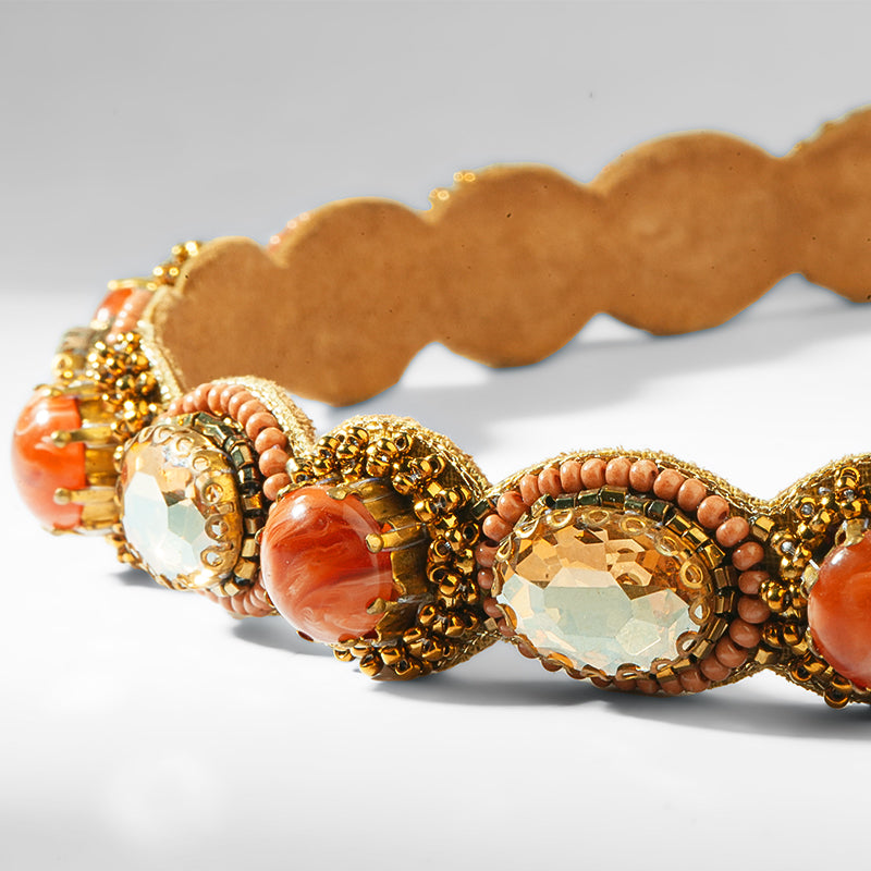 Close up of Deepa Gurnani Pret Zenia Headband in Coral 