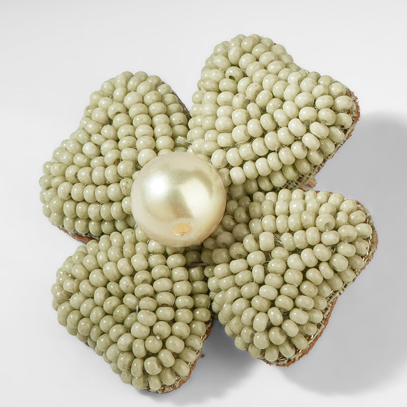 Close up of Deepa Gurnani Liora Earrings is Sage color 