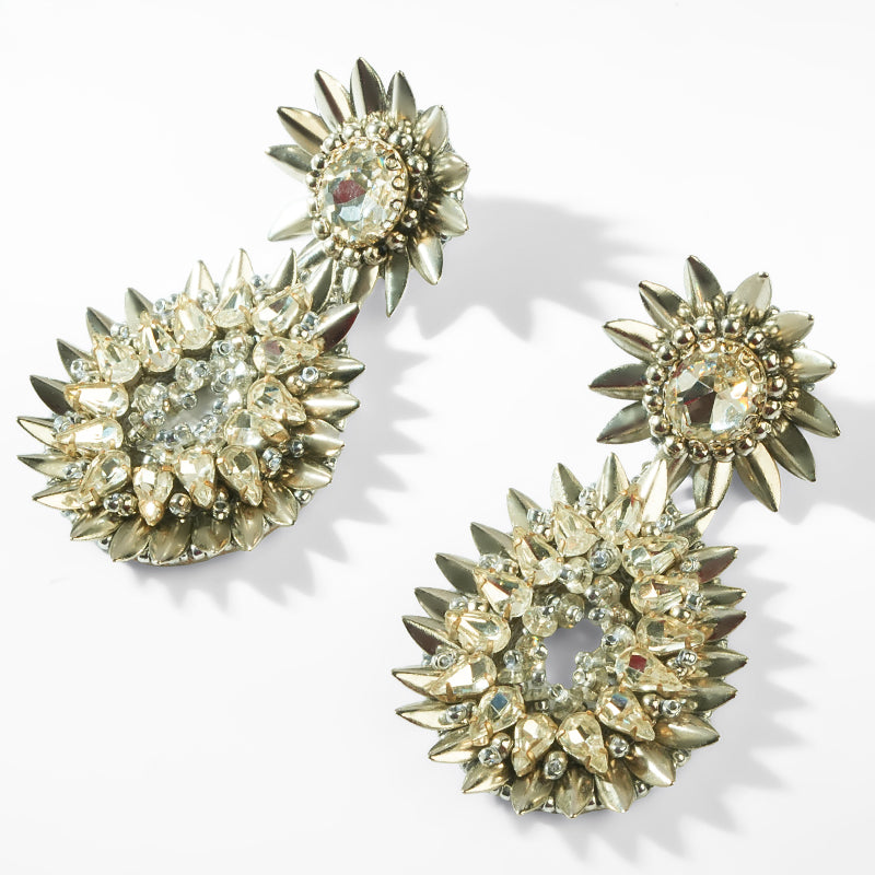 Silver and crystal earrings on a white background