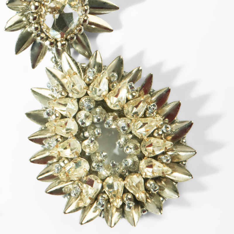 Silver spike earrings on a white background