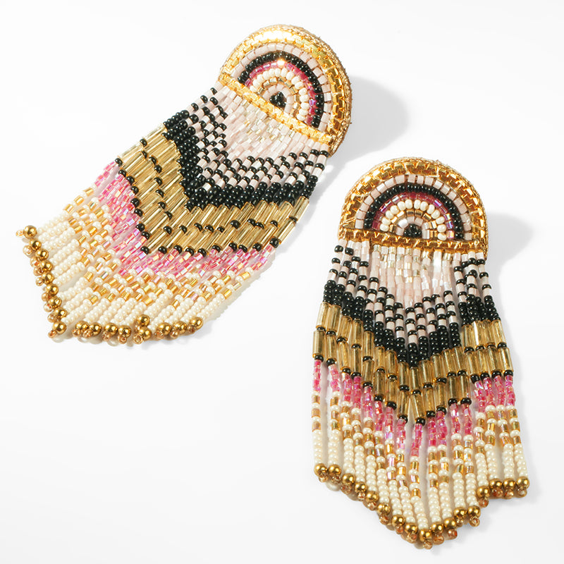 Beaded earrings with pink, black, and gold pattern on a white background