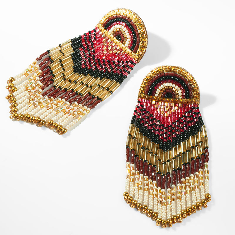 Beaded earrings with red, gold, and black colors on a white background