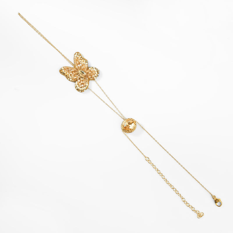 Gold butterfly hand chain on a white background
