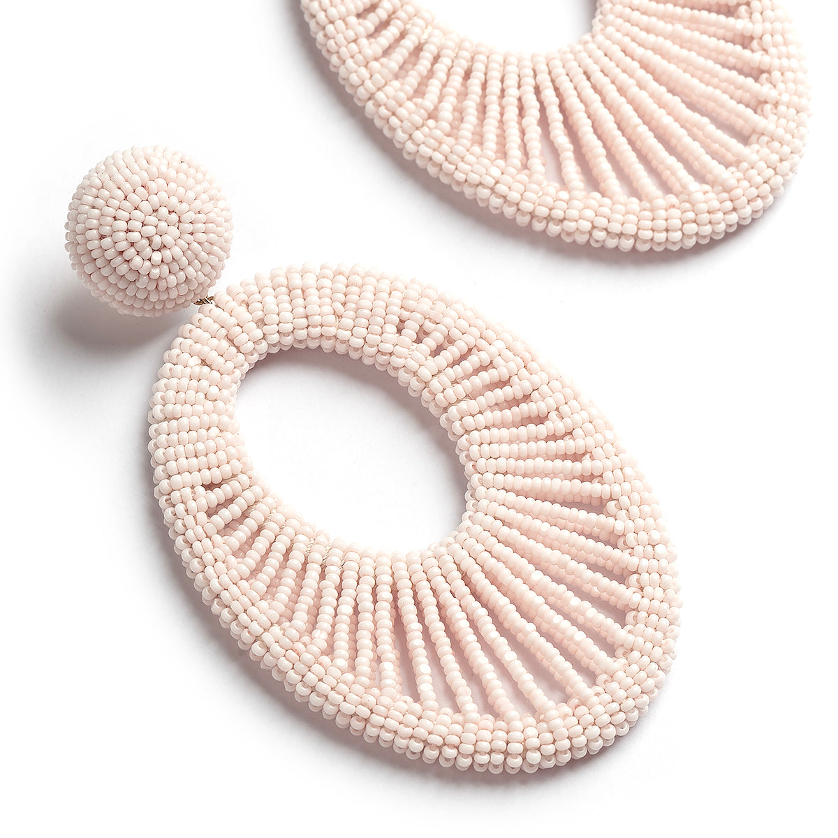 Deepa Gurnani handmade the Cypress earrings in baby pink color