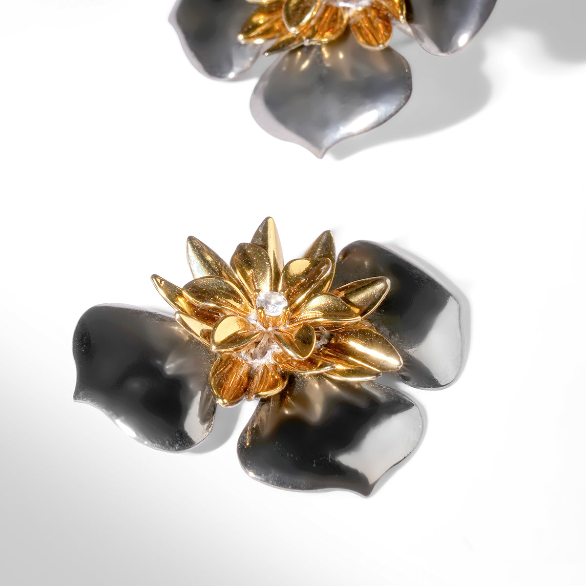 Close up of Deepa Gurnani Pret Baylen Earrings in gunmetal color