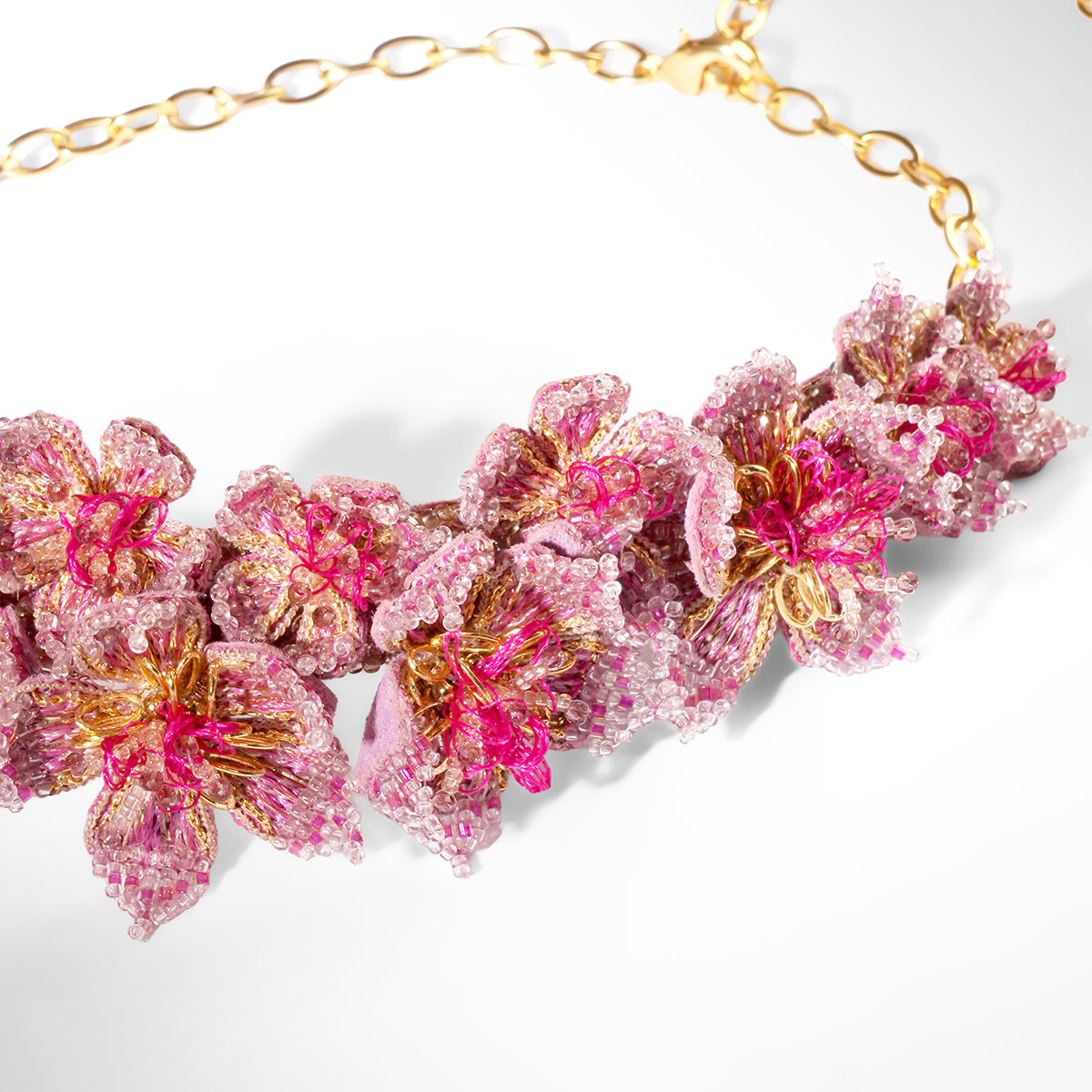 Close up of Deepa Gurnani Adva Necklace in fuchsia 