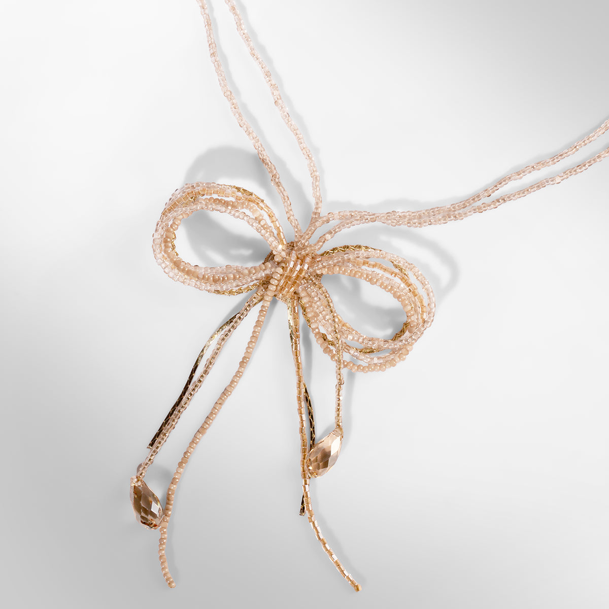Close up of Deepa Gurnani Coquette Necklace in Champagne color 