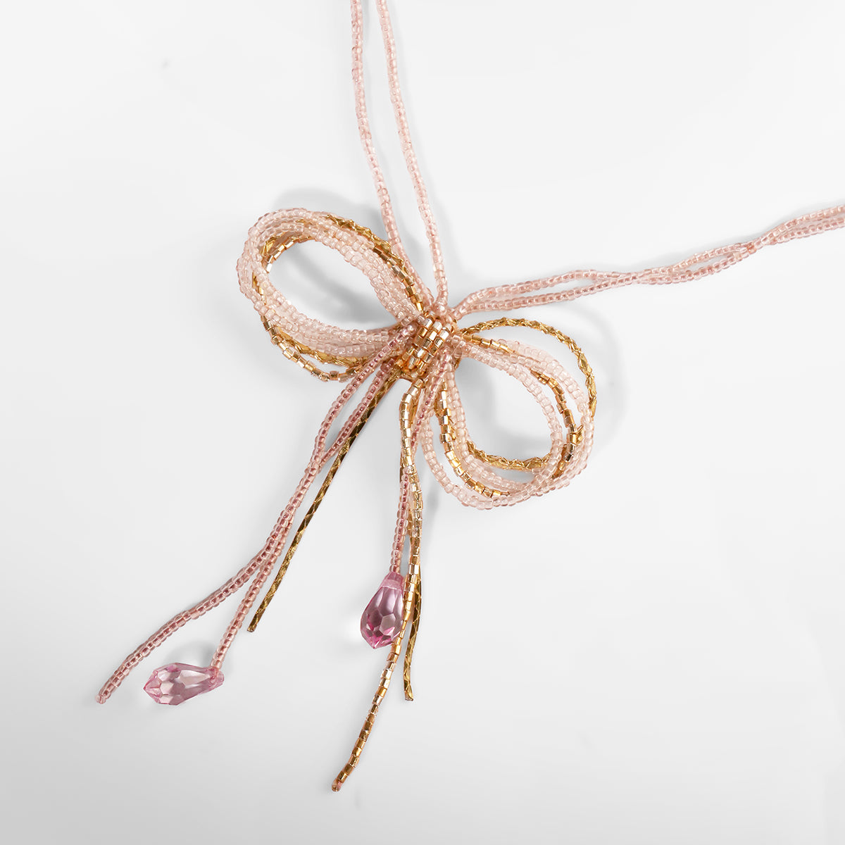 Close up of Deepa Gurnani Coquette Necklace in Pink color