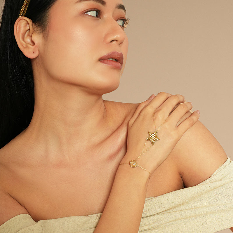 Model wearing Deepa Gurnani Pret Loris Hand Chain