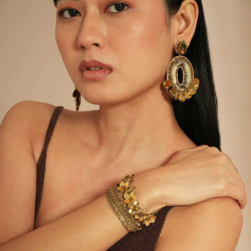 Model wearing Deepa Gurnani Pret Rika Bracelet in Gold 
