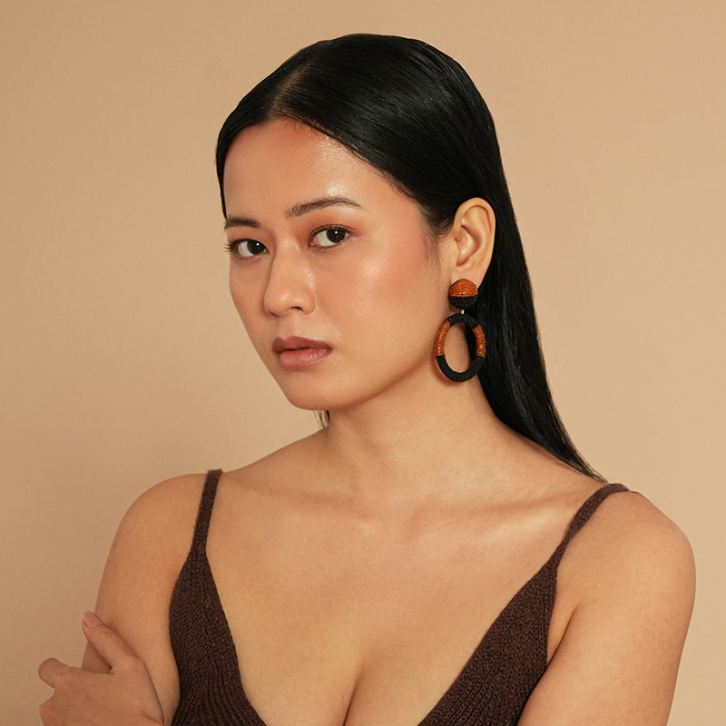 Model wearing Deepa Gurnani Tavara Earrings in Mustard color