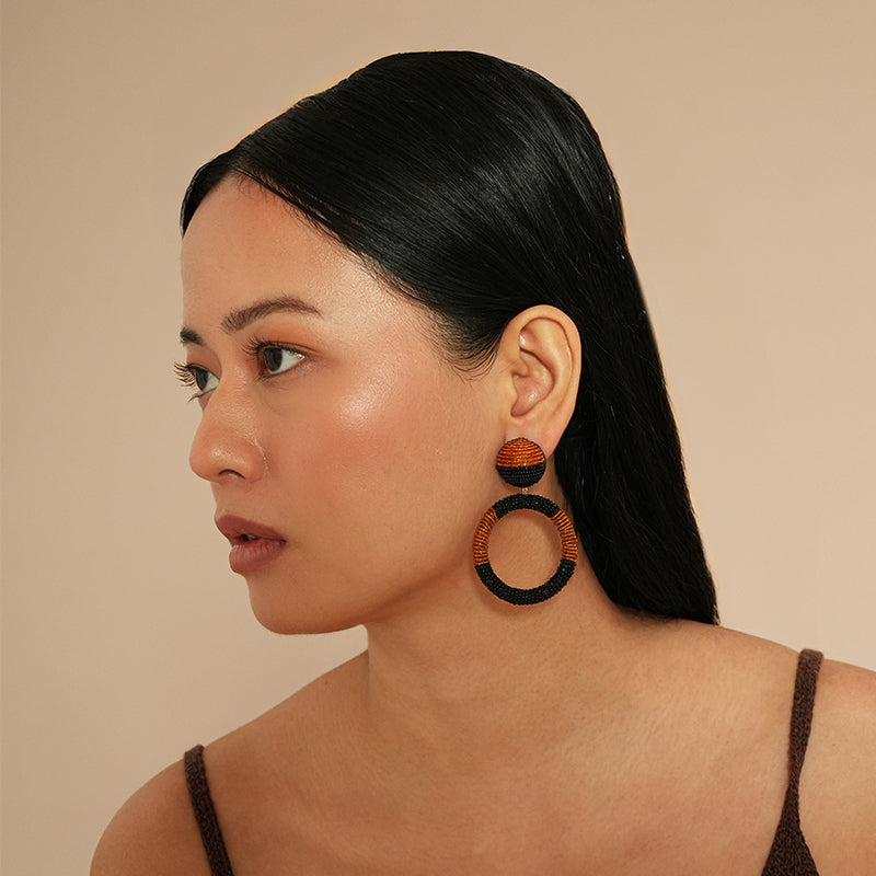 Model wearing Deepa Gurnani Tavara Earrings in Mustard color