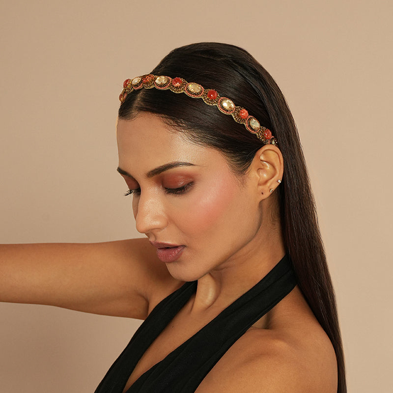 Model wearing Deepa Gurnani Pret Zenia Headband in Coral 