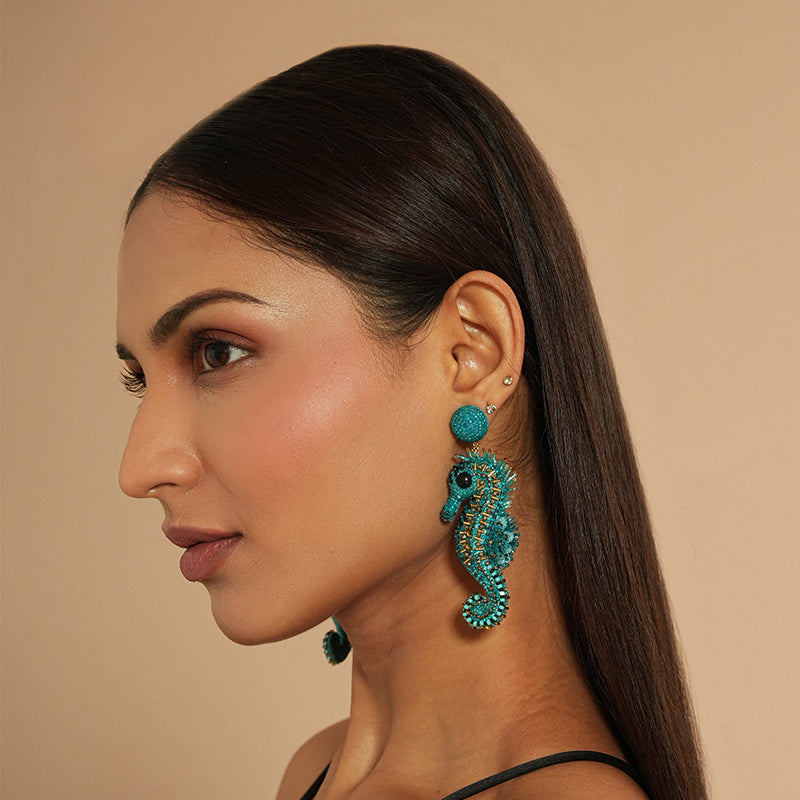 Model wearing Deepa Gurnani Seapony earrings 