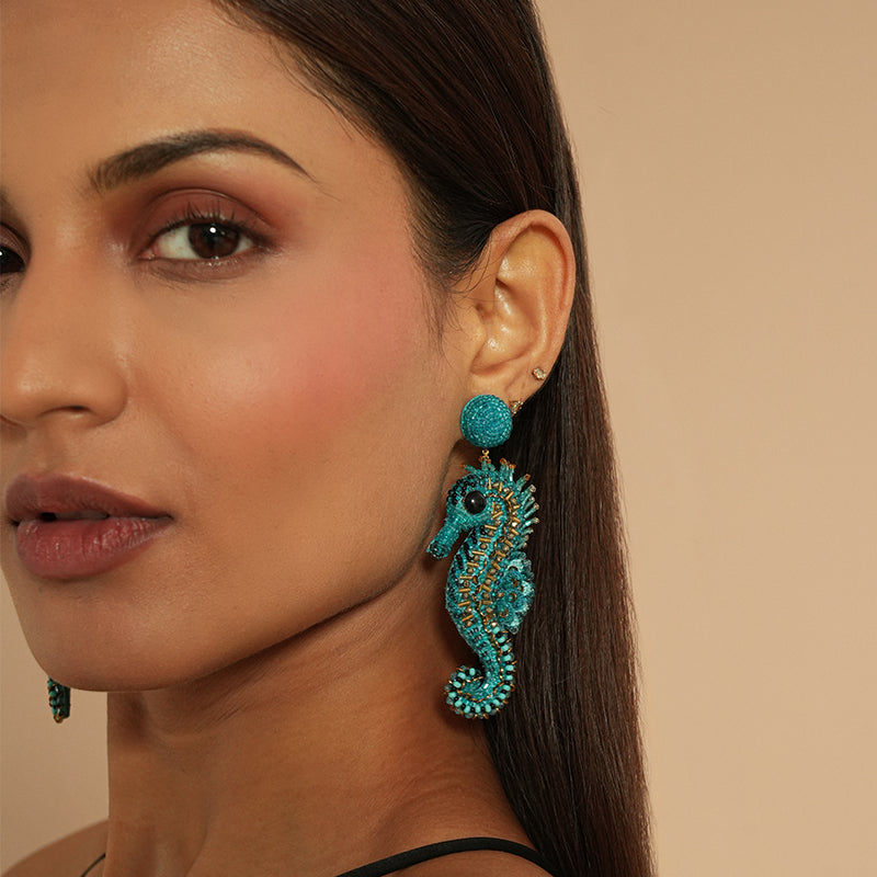 Close up of model wearing Deepa Gurnani Seapony Earrings 
