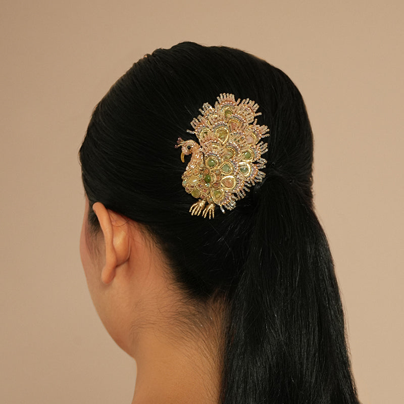Model wearing Deepa Gurnani Maharaja Peacock Brooch