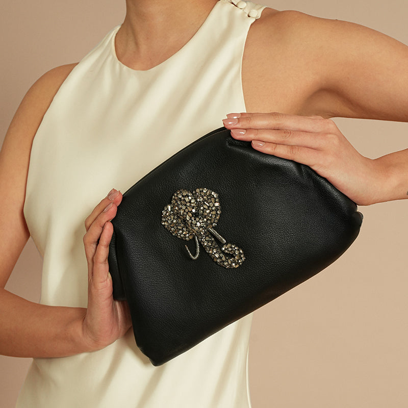Model holding Deepa Gurnani Majestic Clutch 