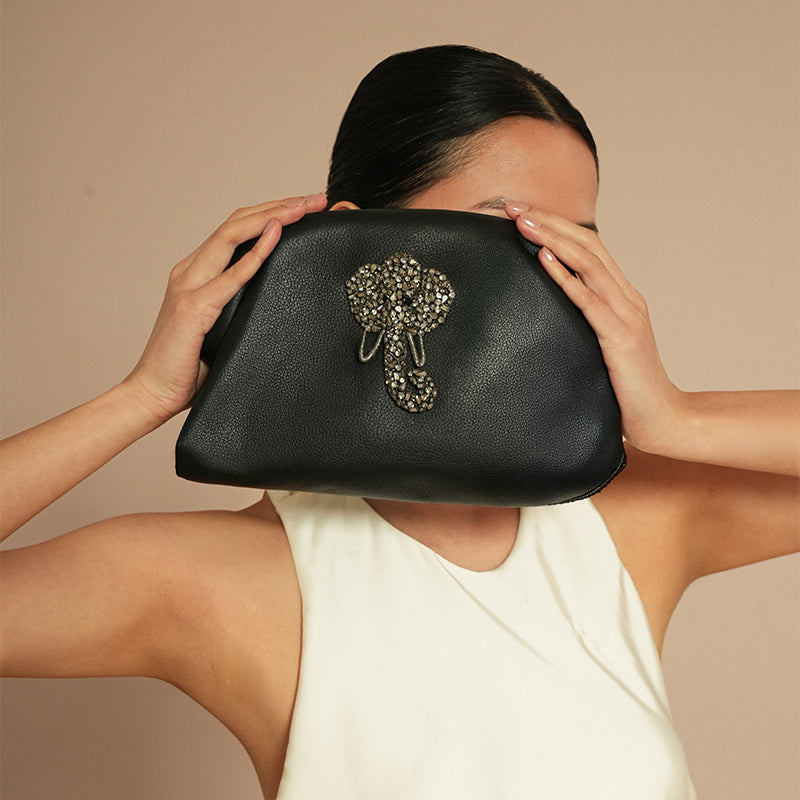Model holding Deepa Gurnani Majestic Clutch 