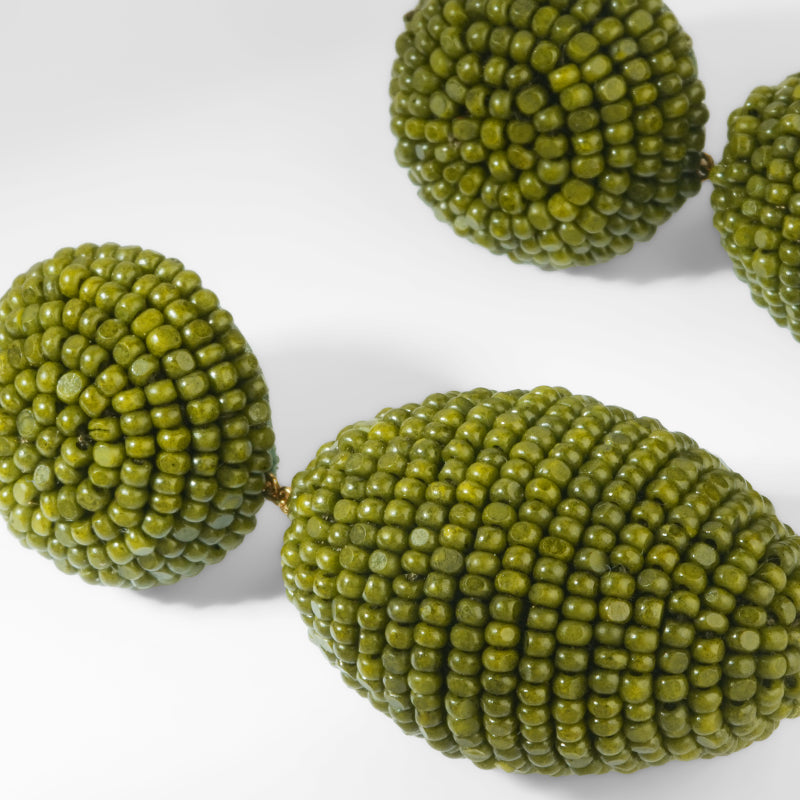 Close up of Deepa Gurnani Lashana Earrings in Olive