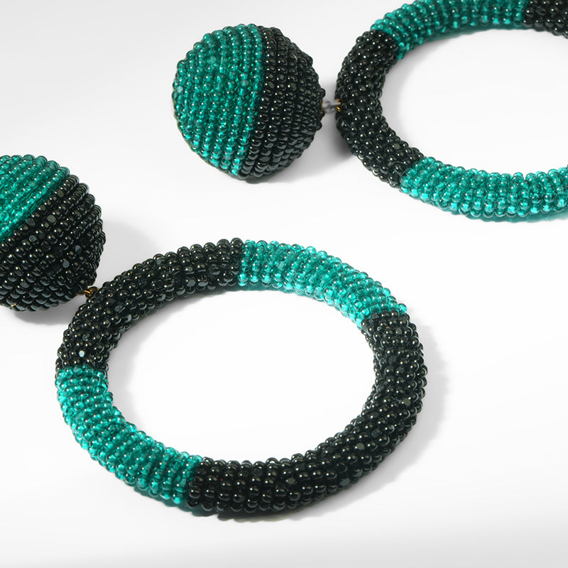 Close up Deepa Gurnani Tavara Earrings in Emerald color