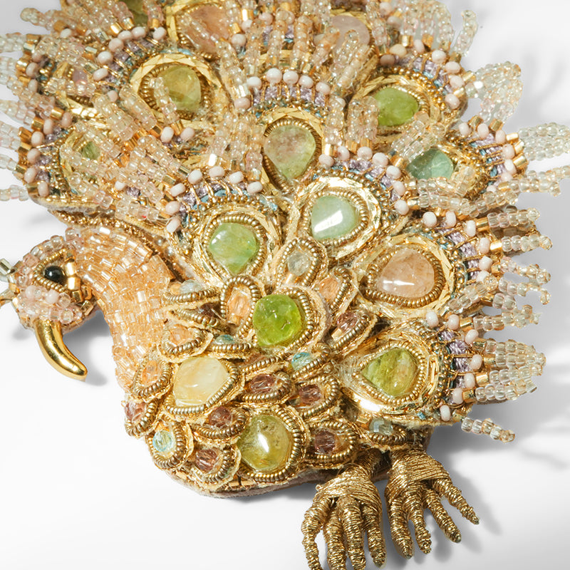 Close up of Deepa Gurnani Maharaja Peacock Brooch