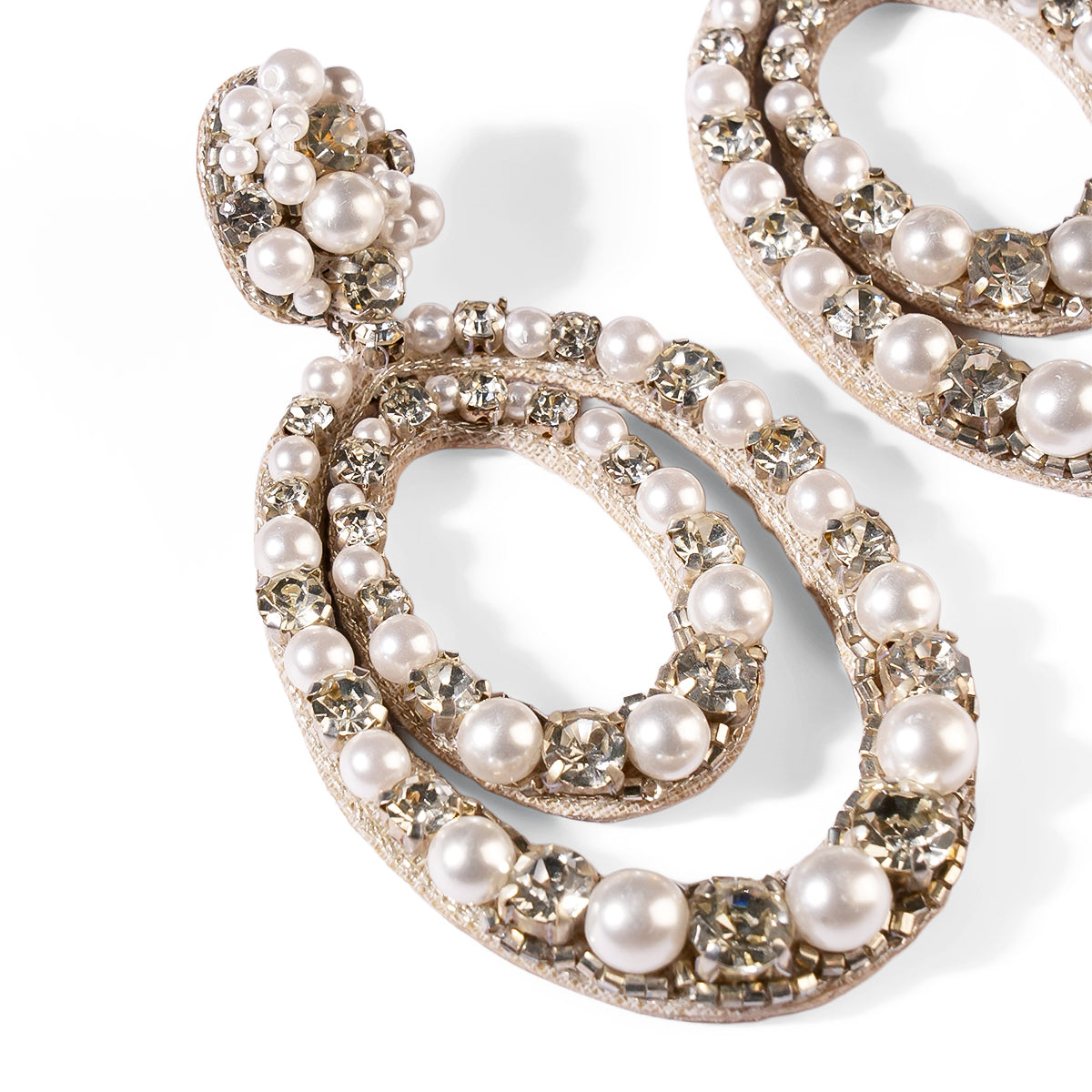 Close up of Deepa Gurnani Pret Spencer Earrings in Silver color