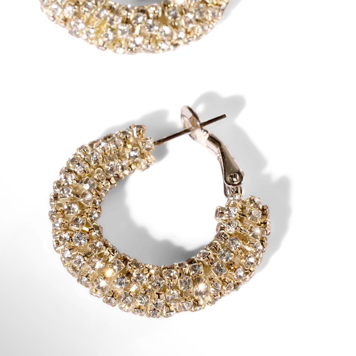 Close up of Deepa Gurnani Sousou earrings in gold color