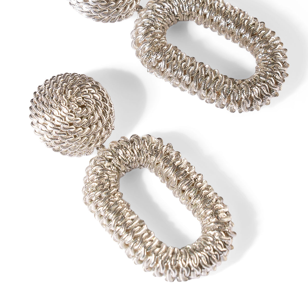 Close up of Deepa Gurnani Pret Roula Earrings in Silver