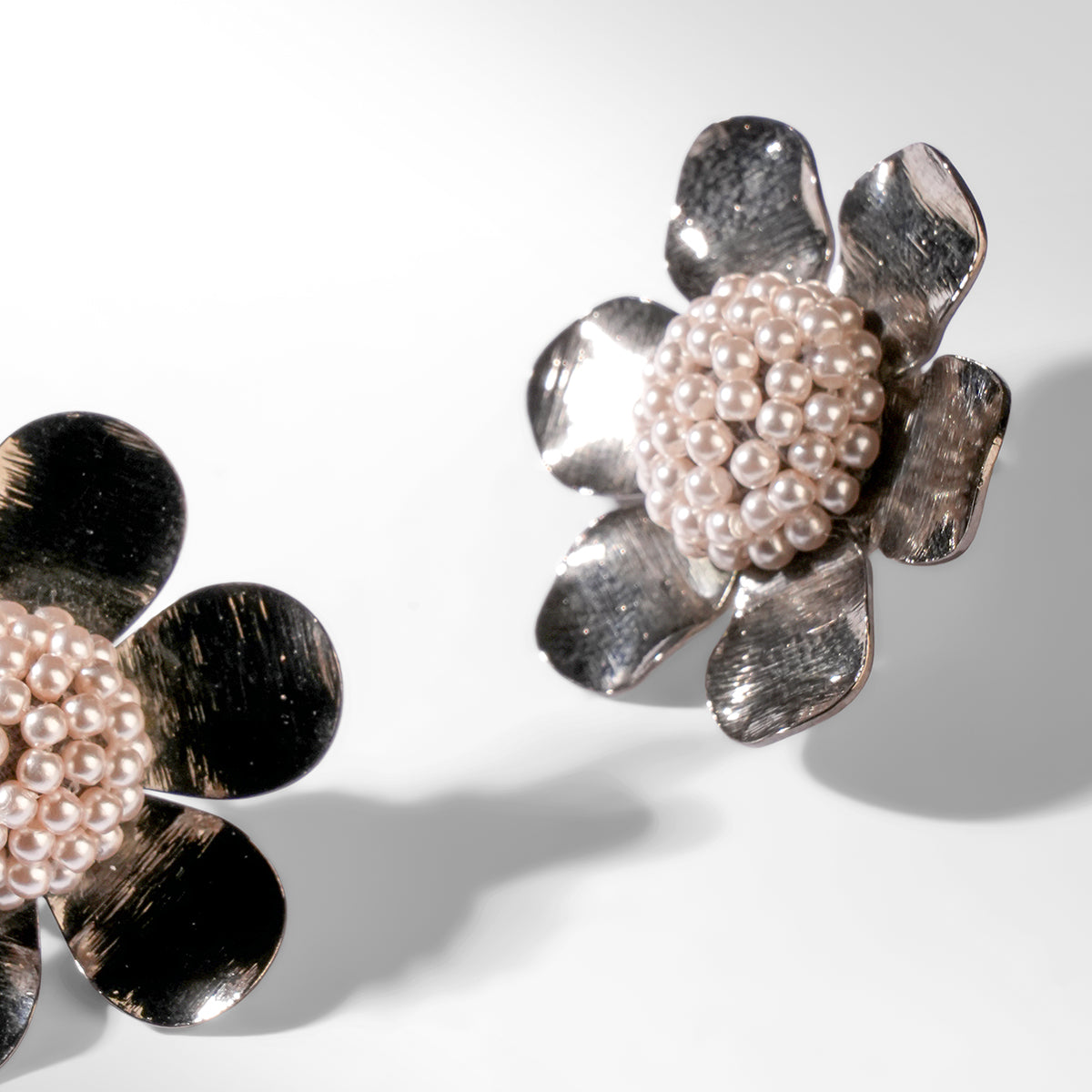 Close up of Deepa Gurnani Curie Earrings in gunmetal color