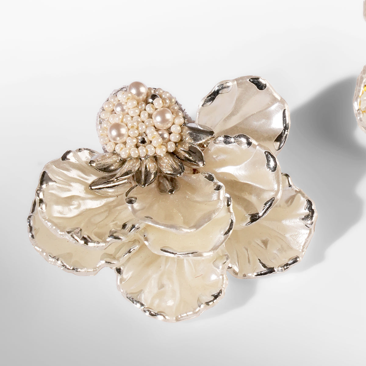 Close up of Deepa Gurnani Pret Wally Earrings in silver color