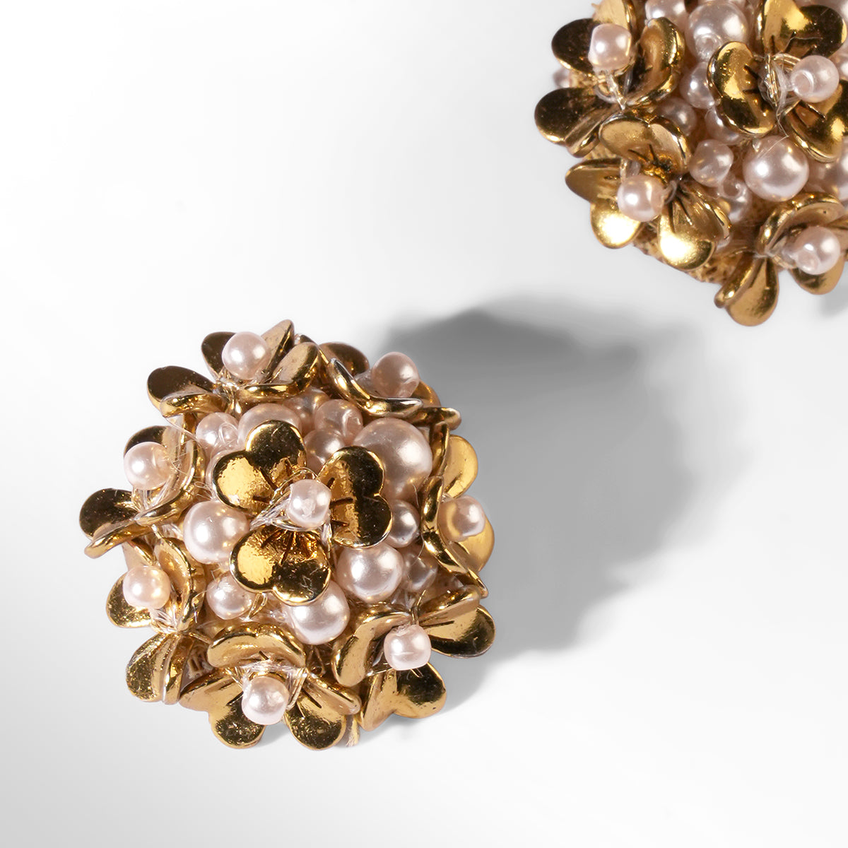 Close up of Deepa Gurnani Pret Kamar Earrings in gold color 