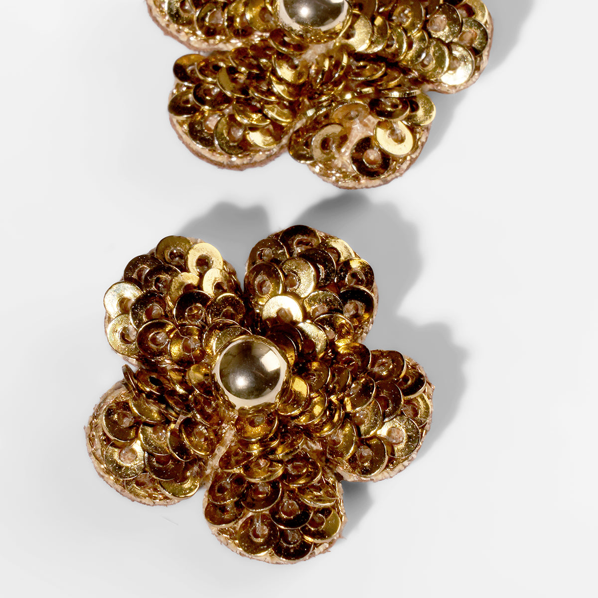 Close up of Deepa Gurnani Pret Kioko Earrings in gold color