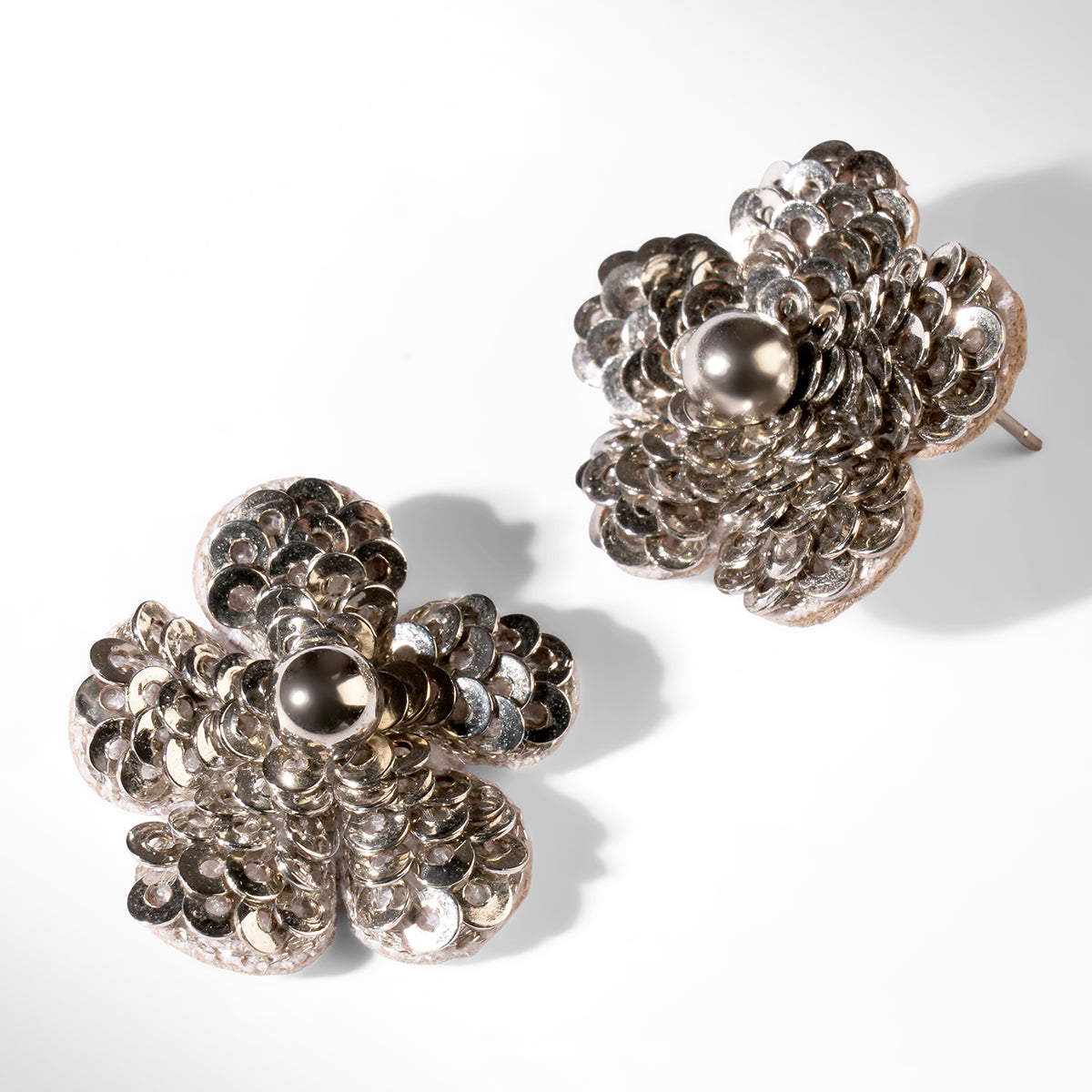 Close up of Deepa Gurnani Pret Kioko Earrings in silver color