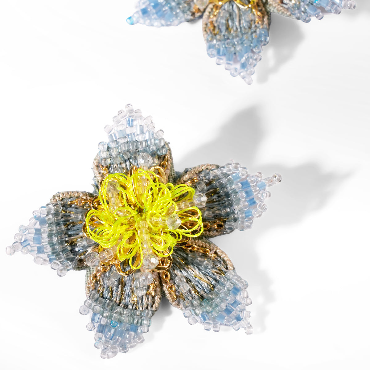 Close up of Deepa Gurnani Adva Earrings in blue color