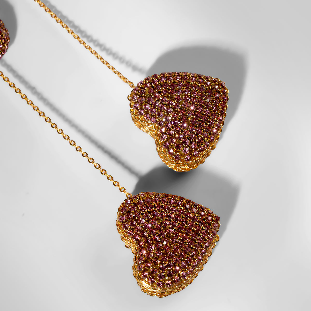 Close up of Deepa Gurnani Eros Earrings in pink color